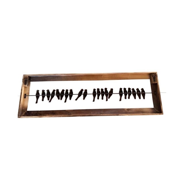 Bring warmth and rustic charm to your home with this handcrafted wall sculpture featuring a flock of perched metal birds...
