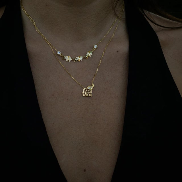 Carry the timeless power of luck, protection, and harmony with our Trinity Elephant Blessings Gold Necklace. Handcrafted...