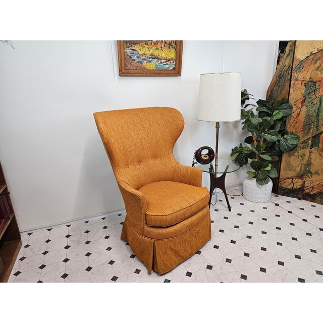 Dramatic curves meet cozy texture in this striking wingback. Description: This chair’s exaggerated, wing-like silhouette...