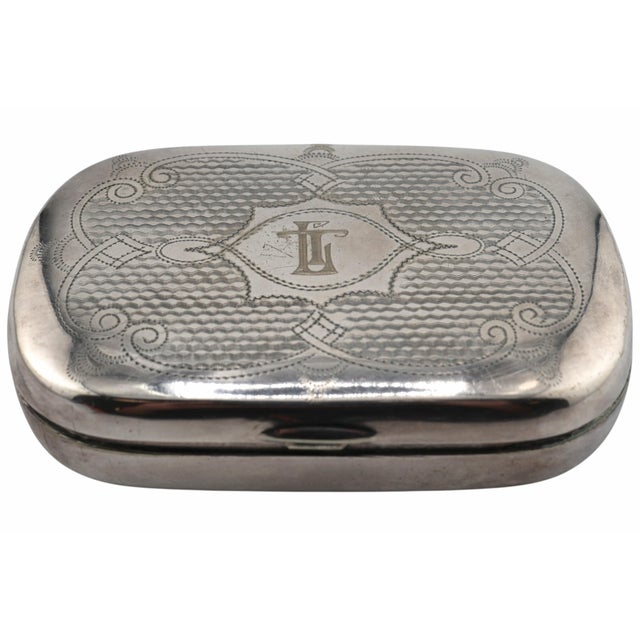 A handsome late Victorian silverplate pocket box featuring a softly rounded rectangular form and a hinged lid, this...
