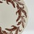 A charming set of vintage Syracuse China dinner plates featuring a warm brown leaf wreath border and an elegant scalloped...