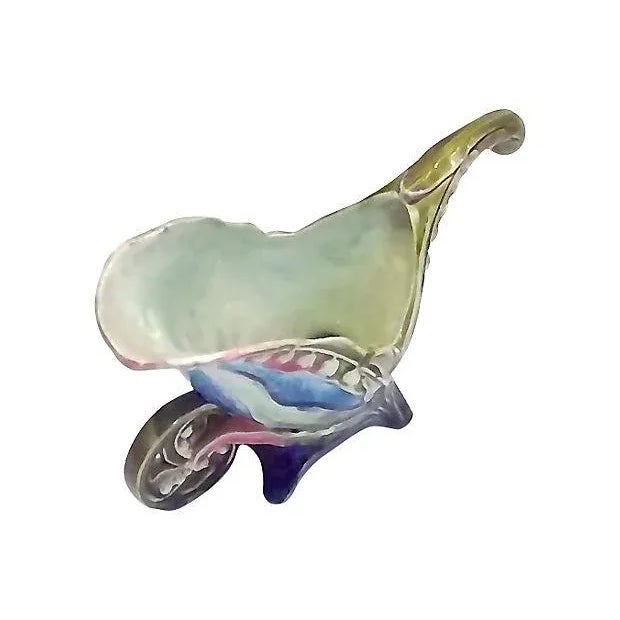 An antique; 19th century, French, Art Nouveau-style, majolica, floral, wheelbarrow, ceramic cachepot. Art Nouveau-style...