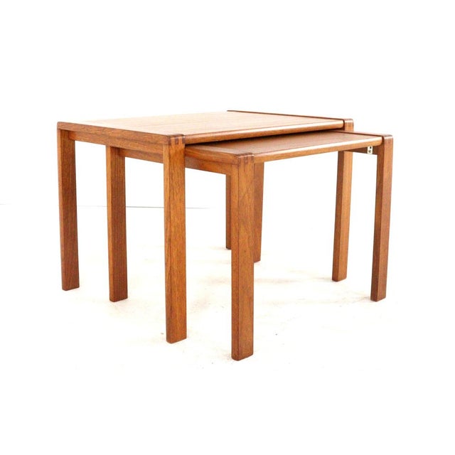 Two side tables that together form a set of "Nesting Tables"; with their minimalist Danish design, they are a feast for...