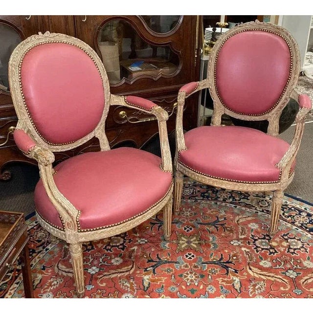 Pair Louis XVI Style Painted Fauteuils, ca. 1870, Having carved crest rails, carved oval backrests with upholstered back...