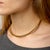 This vintage Tubogas choker necklace is a striking expression of sculptural design and timeless sophistication. Crafted in...