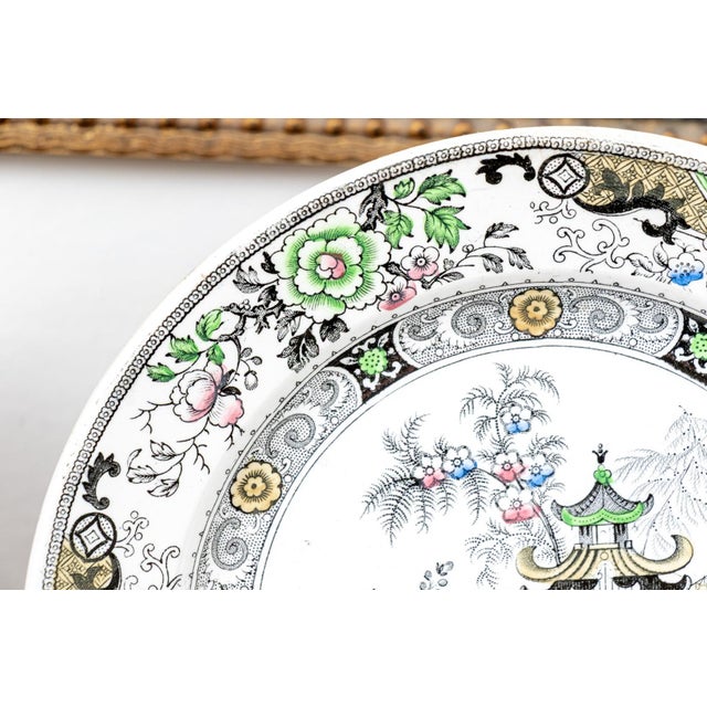 A beautiful pair of antique French creamware plates bearing the prestigious Creil et Montereau maker's mark with Médaille...