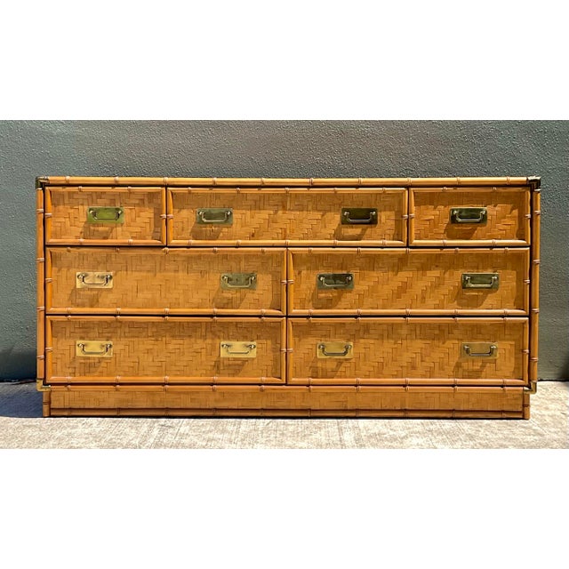 Attributed to iconic American maker Dixie Furniture, this 1960s credenza showcases a masterclass in organic texture and...