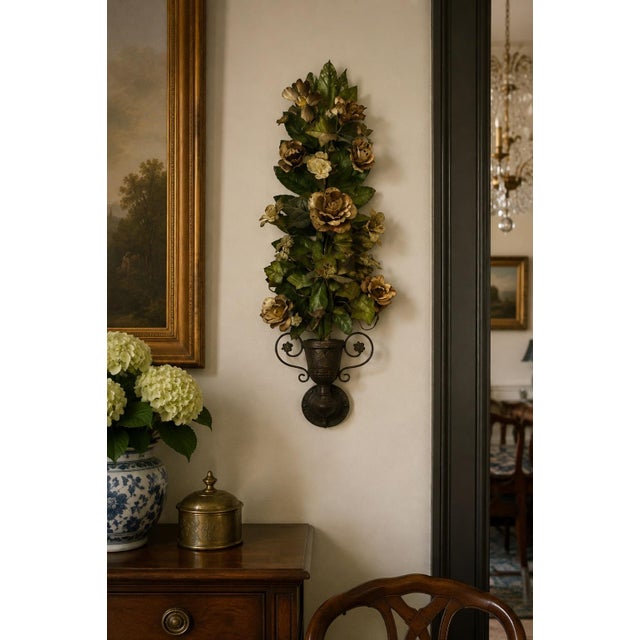 A striking large-scale vintage painted tole floral wall hanging featuring an abundant arrangement of dimensional metal...