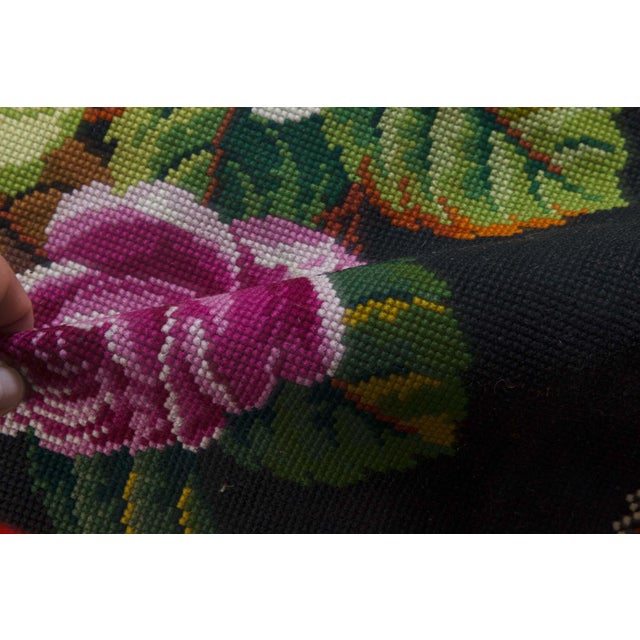 Vibrant and meticulously detailed, this 1950s European needlepoint rug exudes mid-century elegance with its vivid palette...