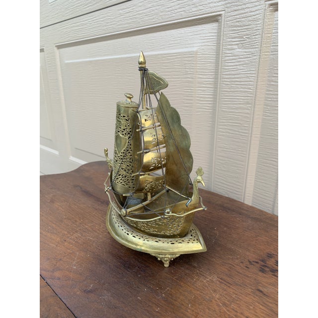 An unusual and beautifully detailed mid-20th century German brass sailing ship nightlight that effortlessly bridges...