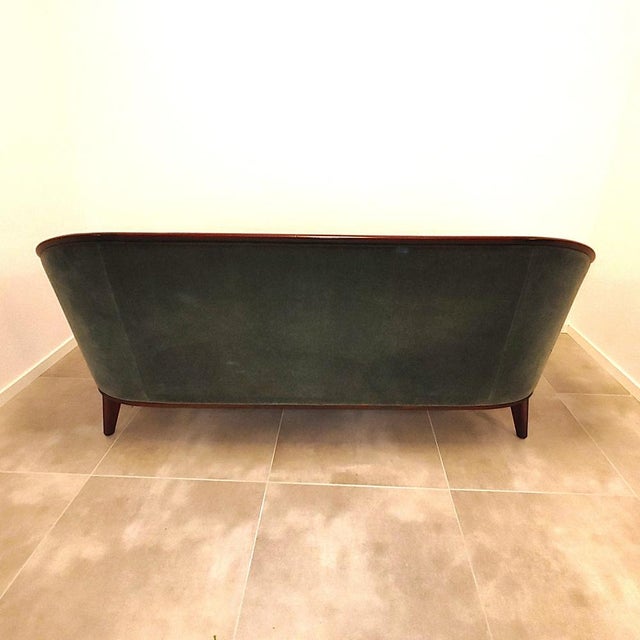 The three-seater sofa, part of the "Aristokrat" line by Fridhagen, is a combination of modern and classic design with the...