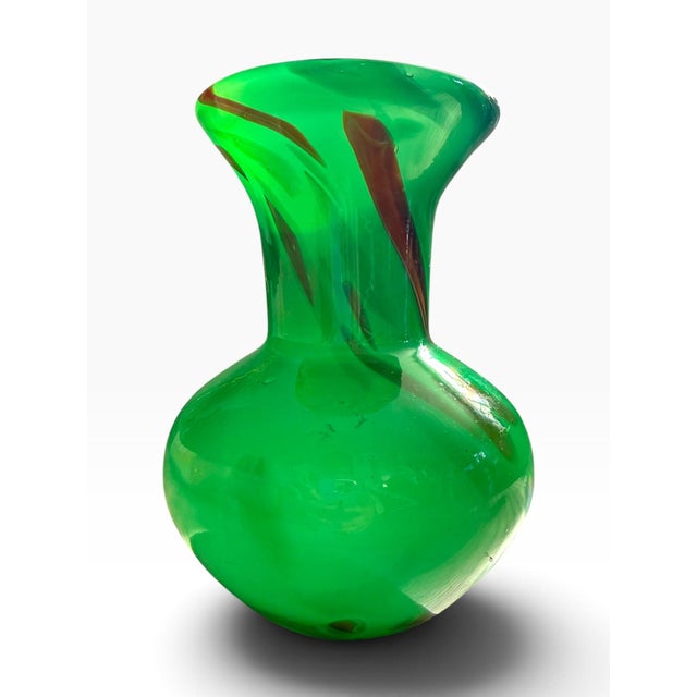 Striking vintage art glass vase in a vivid translucent emerald green, featuring sculptural organic form and dramatic...