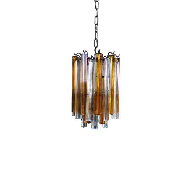 This vintage 1970s murano glass chandelier by venini is an exquisite example of high-quality italian craftsmanship and...