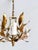 Vintage gilt tole chandelier with four candle-style light arms and hand-formed leaf decoration. Constructed of gilt-...