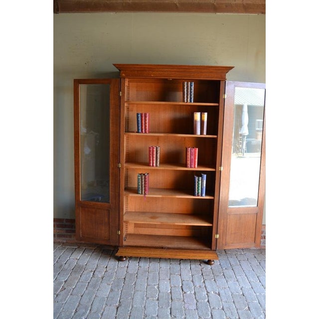 19th-century Dutch oak Art Deco bookcase, display cabinet, shop cabinet, china cabinet, or library cabinet. Entirely...