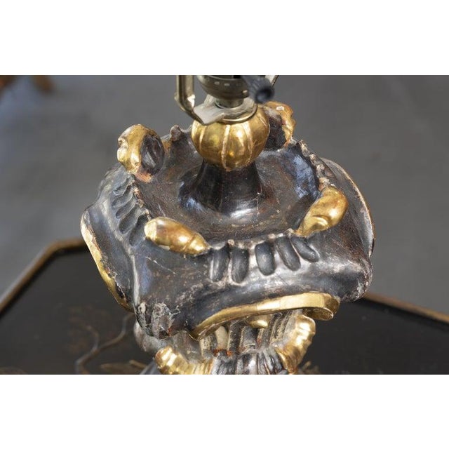 This is a dramatic Italian Baroque-style table lamp crafted in the form of a richly carved urn, featuring bold scrolling...