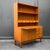 Product. Shelving unit style. Mid-century · 1960s material. Teak veneer features. Two-piece · upper section with three...