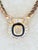 Authentic early‑1970s Christian Dior necklace featuring a geometric gold‑tone pendant framed in glossy black enamel with a...