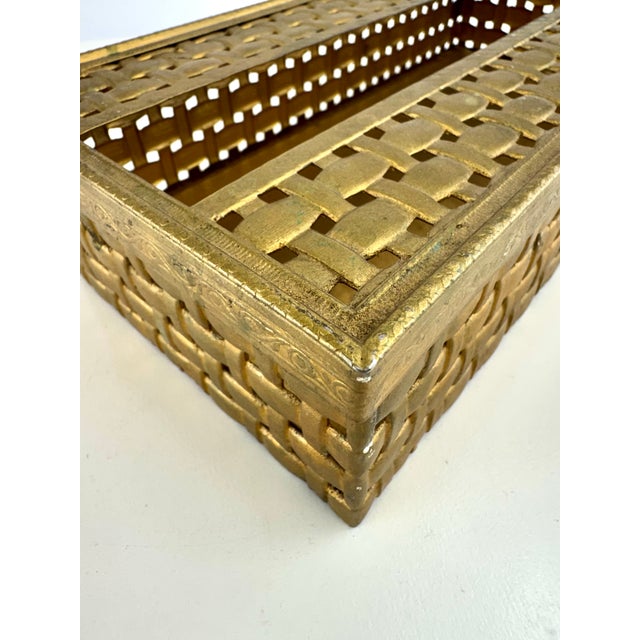 A beautiful vintage Hollywood Regency tissue box and guest towel holder crafted in gold-tone metal with an intricate open...