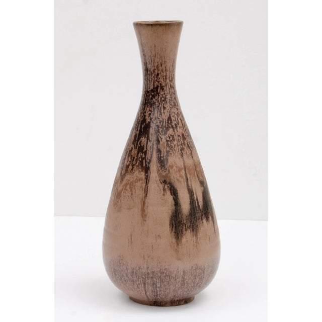 An impressive Mid Century Modern floor vase. Unmarked. The piece is reminiscent of the glazes produced in West Germany in...