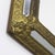 Decorative antique mirror with a brass frame. This mirror has a unique shape, and the brass has developed a beautiful...