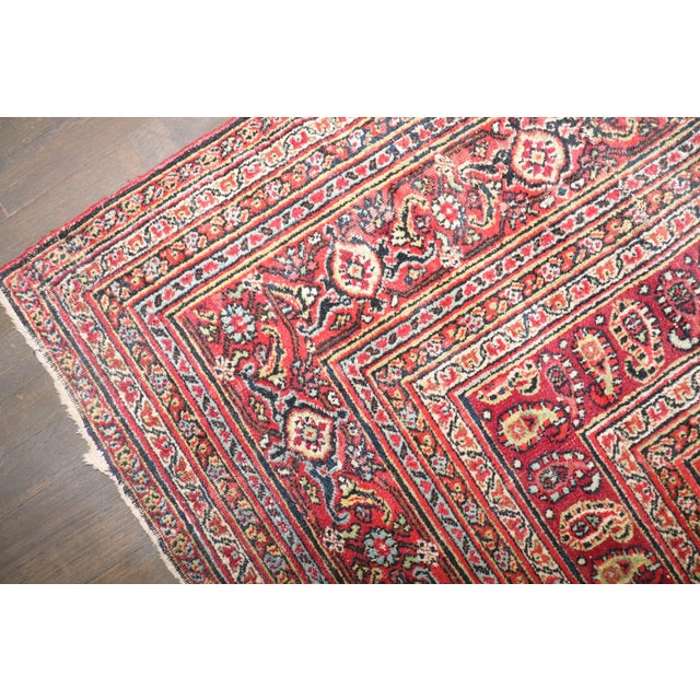 A 19th Century Distressed Persian Doroksh Rug with a hunting animal design on a green field 10'2''' x 12'10''