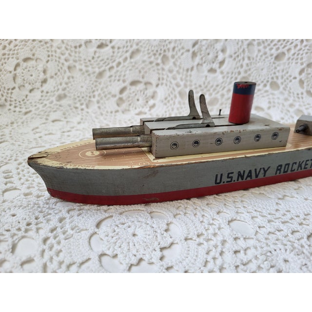 A wooden US Navy Radar-Rocket Ship that is marked 'Made in USA' and was produced by Keystone Toys. Created during the...