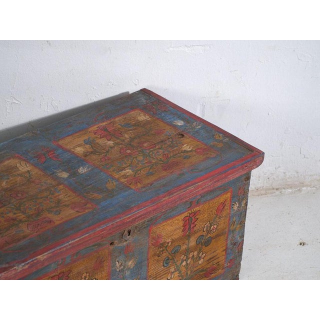 Antique painted folk chest crafted in solid pine wood in Central Europe around 1900.This type of traditional storage...