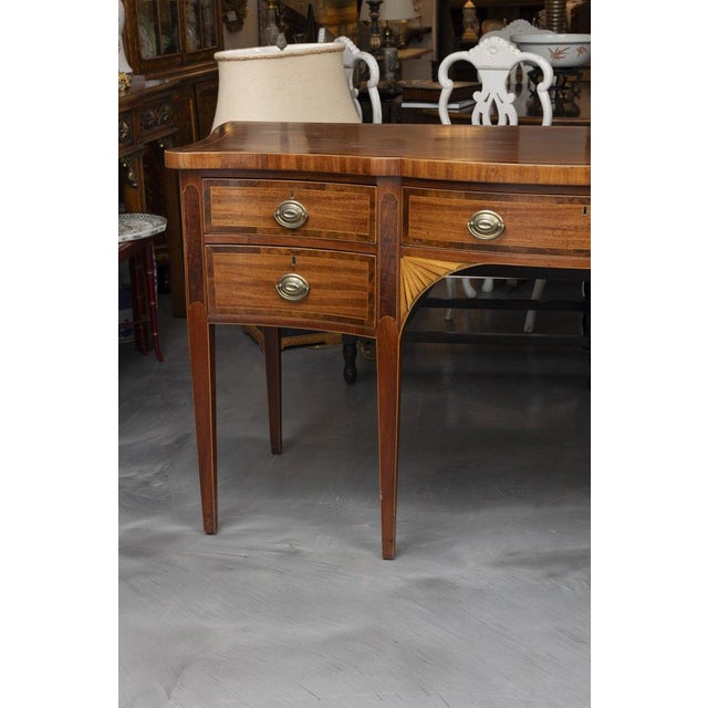 This is a finely crafted George III style mahogany sideboard, showcasing elegant satinwood crossbanding and string inlay...