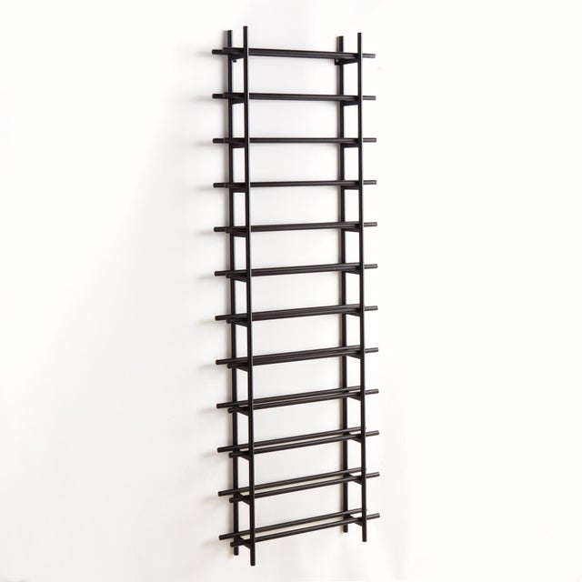 Clean and modern, this handsome wine rack is made of round metal stock. It effortlessly showcases your favorite twelve...