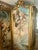 Magnificent 19th-century French Rococo-style three-panel folding screen featuring exquisite hand-painted cherubs, floral...