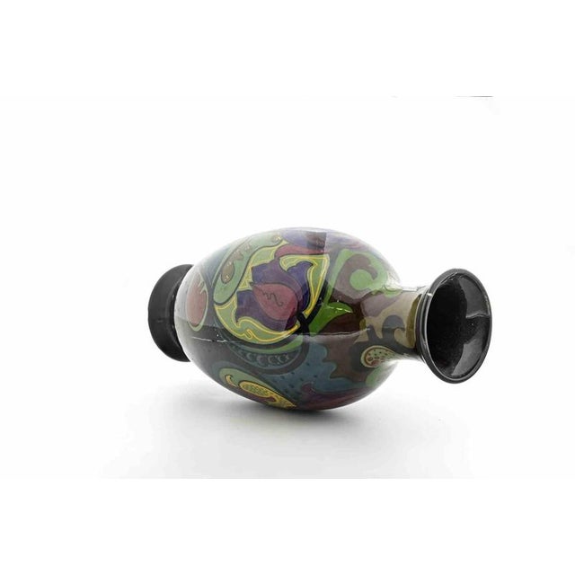 Hand-painted earthenware, marked underneath “Gouda Holland”, with model number 812. This striking vase exemplifies the...