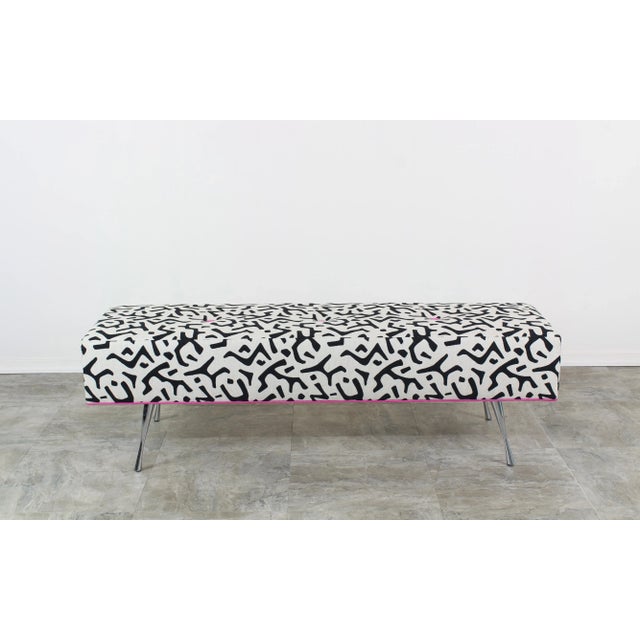 Custom made ottoman upholstered in a abstract black and white linen, accented with fuchsia velvet bottoms and piping This...