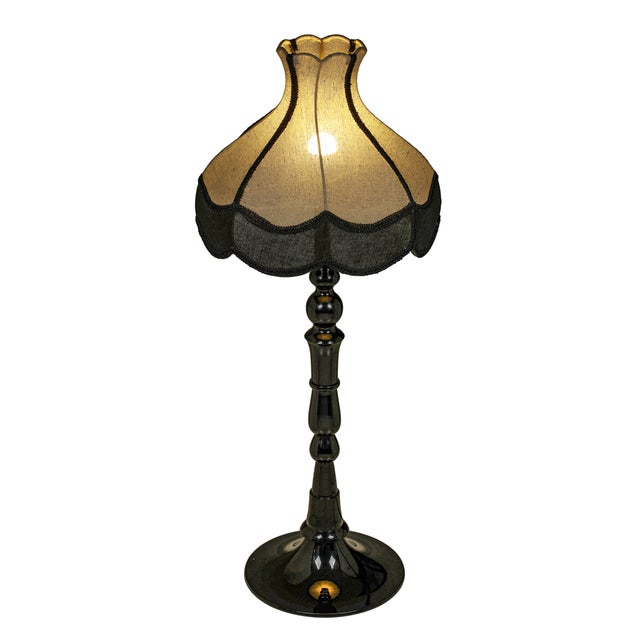 The Buchanan table lamp blends classic charm with modern flair. Its retro, old-world silhouette feels familiar and...