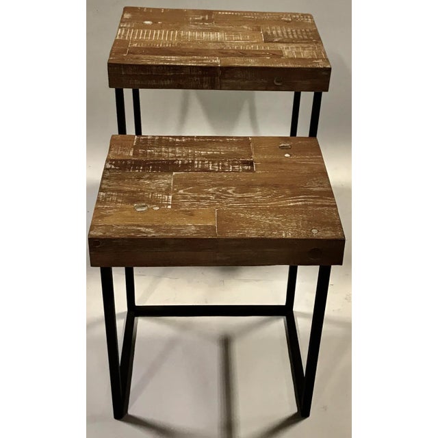 A versatile pair of modern tables with wooden tops. Ideal for any decor. Large table dimensions are 23 3/4" high x 16"...