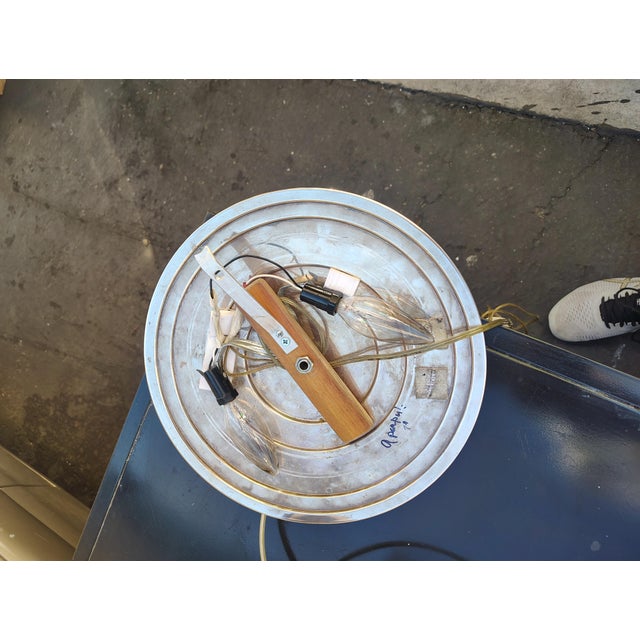 This wall light has two left and right light sources on the piece it's made of silver plated steel and brass the main...