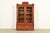 An exceptional antique Eastlake Victorian bookcase cabinet In the manner of Herter Brothers USA, Circa 1880s Carved...