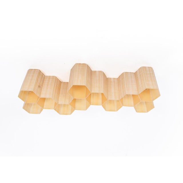 Molecular modern lighting object. The lamp is composed of eleven hexagonal tubes on a white lacquered frame, creating the...