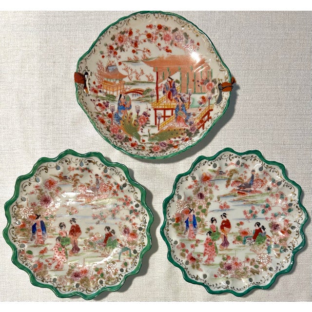 Offered is a beautiful set of seventeen (17) hand painted plates, bowls, and a moriage tray made in Japan circa 1920....