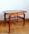 Rectangular teak coffee table resting on four legs, with a rattan stretcher in a grid pattern (refurbished). Elegant and...