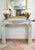 Antique Louis XV-style fireplace in white Carrara marble dating from the early 19th century. The lintel is slightly arched...