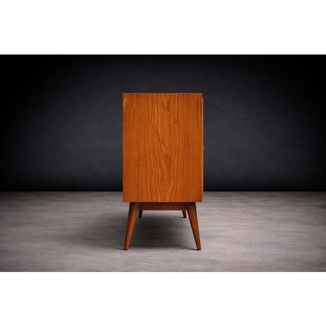 Designed by Joaquim Tenreiro in 1942, this credenza dates to the designer’s final year at Laubisch & Hirth, a leading...