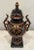 This elegant Grecian Style Urn will enhance your mantel or shelf with it's timeless classical design. The sleek black...