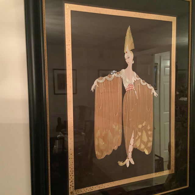 Erte’s large sized serigraph titled “Gown Orientale” featuring a lady wearing a costume. This is a signed limited edition...