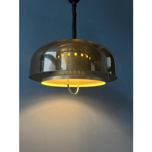 Beautiful space age pendant by the Dutch brand Herda. The lamp has an acrylic glass outer shade and an aluminium inner...