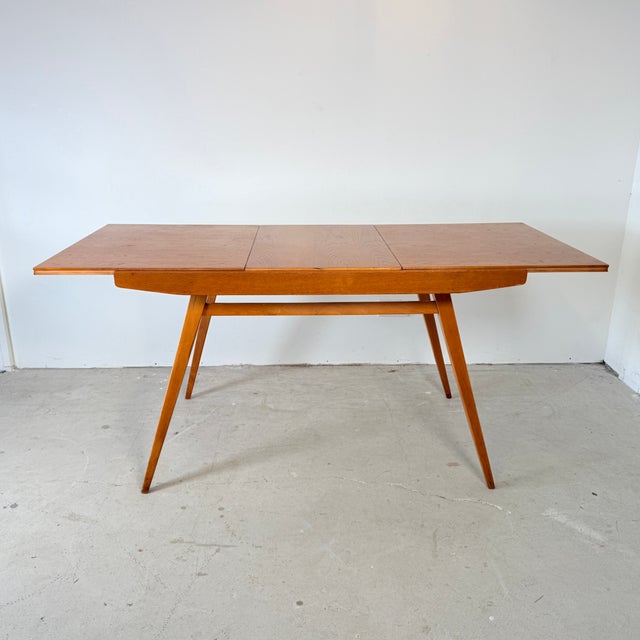 This striking dining table from the former Czechoslovakia was designed by František Jirák and produced by Tatra Nábytok....