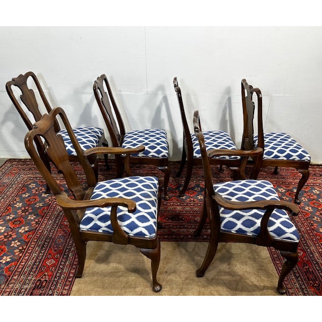 Elevate your dining experience with this exquisite set of six Baker Style Furniture Queen Anne-style dining chairs....
