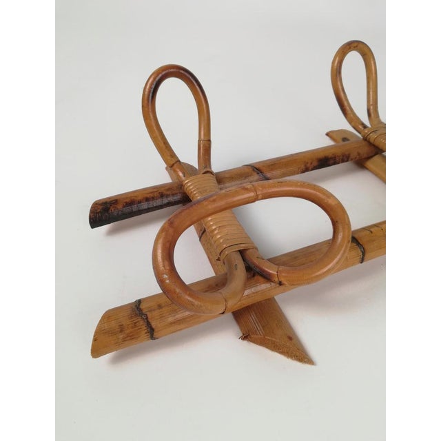 A wall Wall Coat Rack made in Italy between 1960 and 1970. Completely made with natural fibers, thick bamboo canes were...