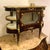 Exquisite French Louis XV-style display cabinet featuring a richly polished dark mahogany finish, ornate gilt bronze...