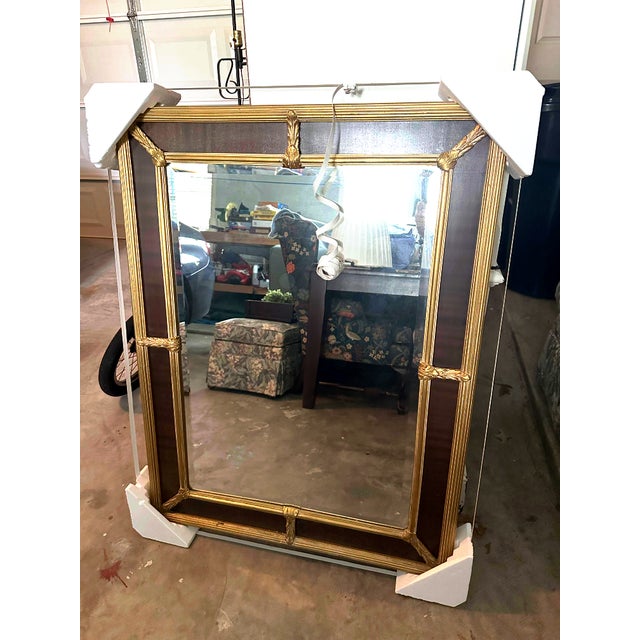 Bring timeless elegance to your space with this vintage Carvers’ Guild Regency-Style Giltwood Wall Mirror. Known for their...